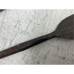 Native long-shafted spear, the large iron head with central medial ridge and decorative neck, on plain circular haft L260cm; and another similar Native long-shafted spear with cane haft L249cm (2)