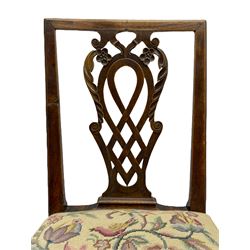 George III walnut side chair, foliate carved pierced and lattice splat decorated with flower heads and scrolls, moulded framed, the drop-in seat upholstered in floral needlework, on square moulded supports joined by H-stretchers