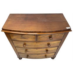 Victorian mahogany bow-front chest, fitted with two short over three long drawers with step canted facias and turned handles, on chunky turned feet
