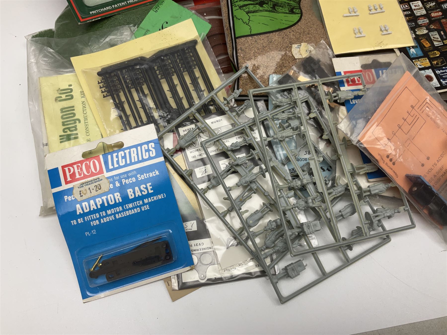 '00' gauge layout accessories - Langley Miniatures Footbridge kit, wagon kits by Nu-Cast, Colin Ashby, Slaters etc, layout chippings, fencing, sprues of figures and accessories, switches and motors, Peco Lectrics, name plates, transfers etc; most boxed or packaged