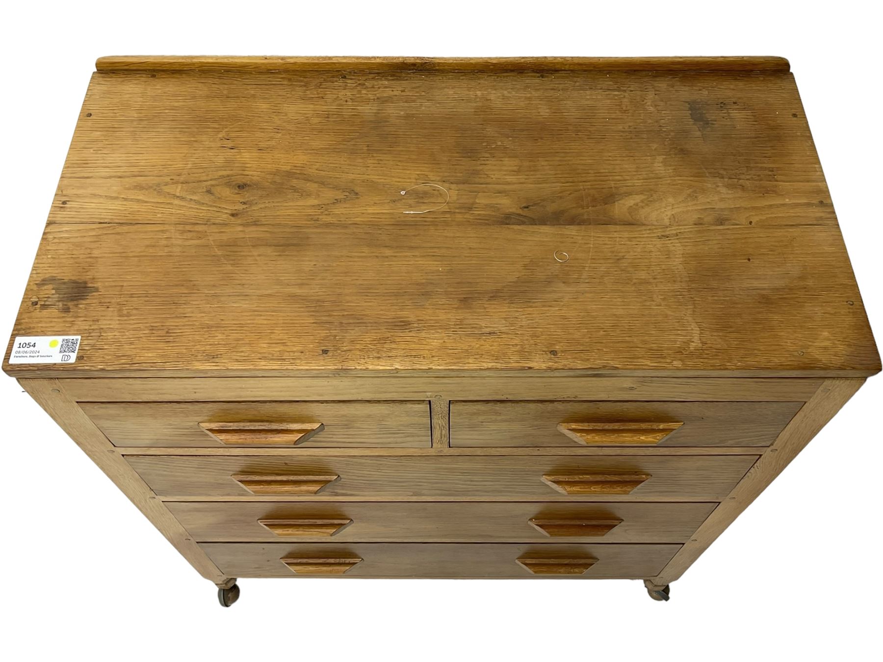 Yorkshire Oak - oak chest, fitted with two short over three long drawers, on octagonal feet with castors 