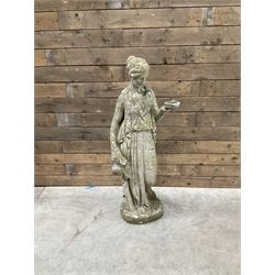 Pair of cast stone garden dogs and 2 female figures,