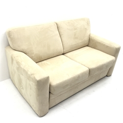 Two seat sofa bed upholstered in cream fabric, W155cm