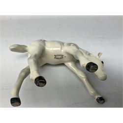 Collection of Beswick horses, including grey horse no.701, palomino foal no 836, grey stocky jogging mare no.855 etc, together two Royal Doulton horses, (8)