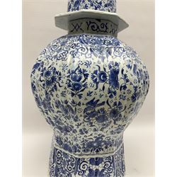 Large Delft blue and white vase and cover, of reeded baluster form, the domed cover with dog finial, decorated throughout with birds, flower heads and foliate motifs, with painted marks beneath, H55.5cm