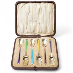 Set of six silver gilt coffee spoons with spade shape bowls, each stem with different coloured enamel and in original case Birmingham 1926/27 Maker Levi & Salaman
