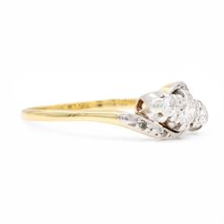 18ct gold diamond crossover ring, set with three old cut diamonds and two diamond chips either side, Birmingham 1982, total diamond weight approx 0.30 carat