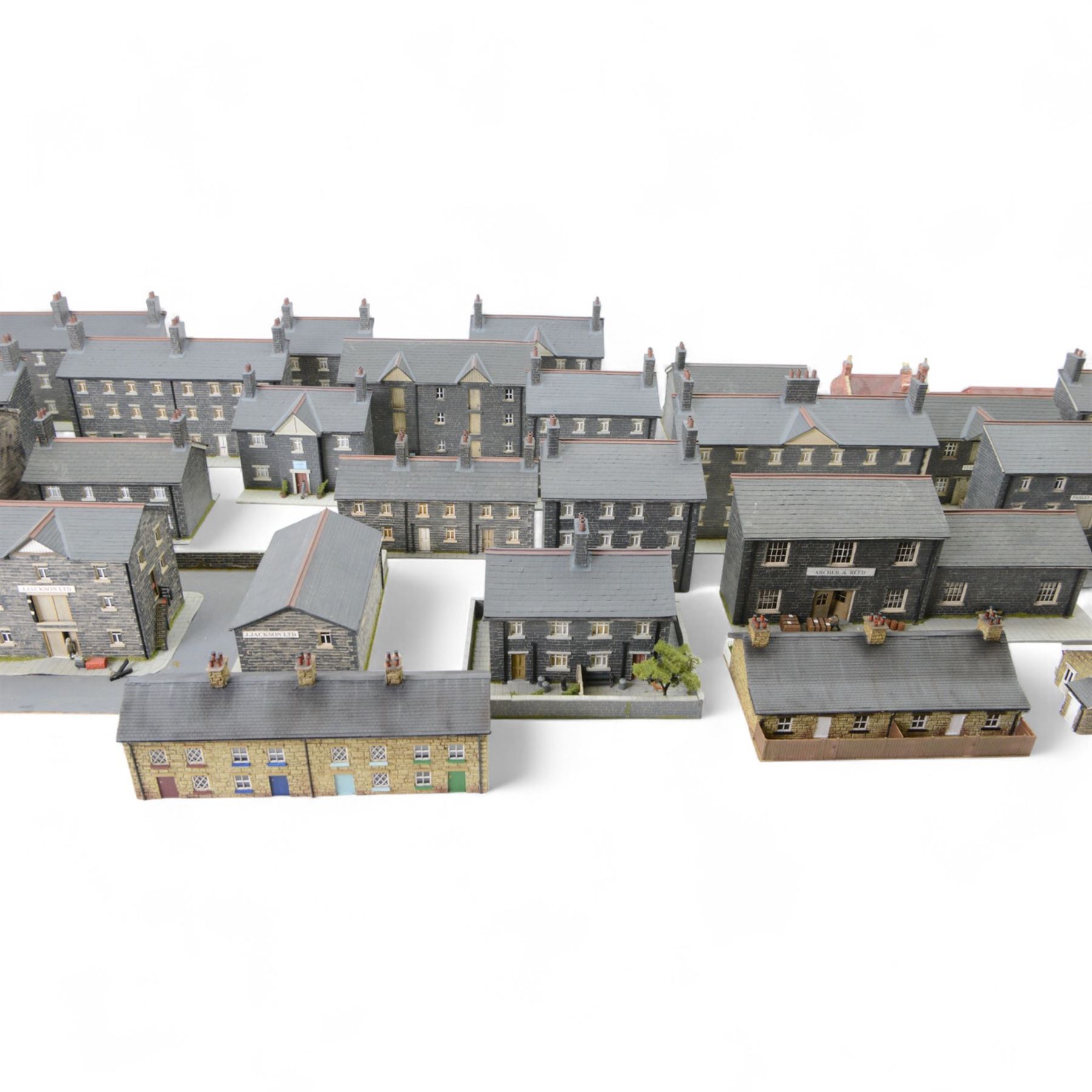 Thirty 00 gauge model railway trackside buildings, six by Martin's Models York including church and terraced houses and twenty-four kit-built examples all grey stone effect houses and farm buildings