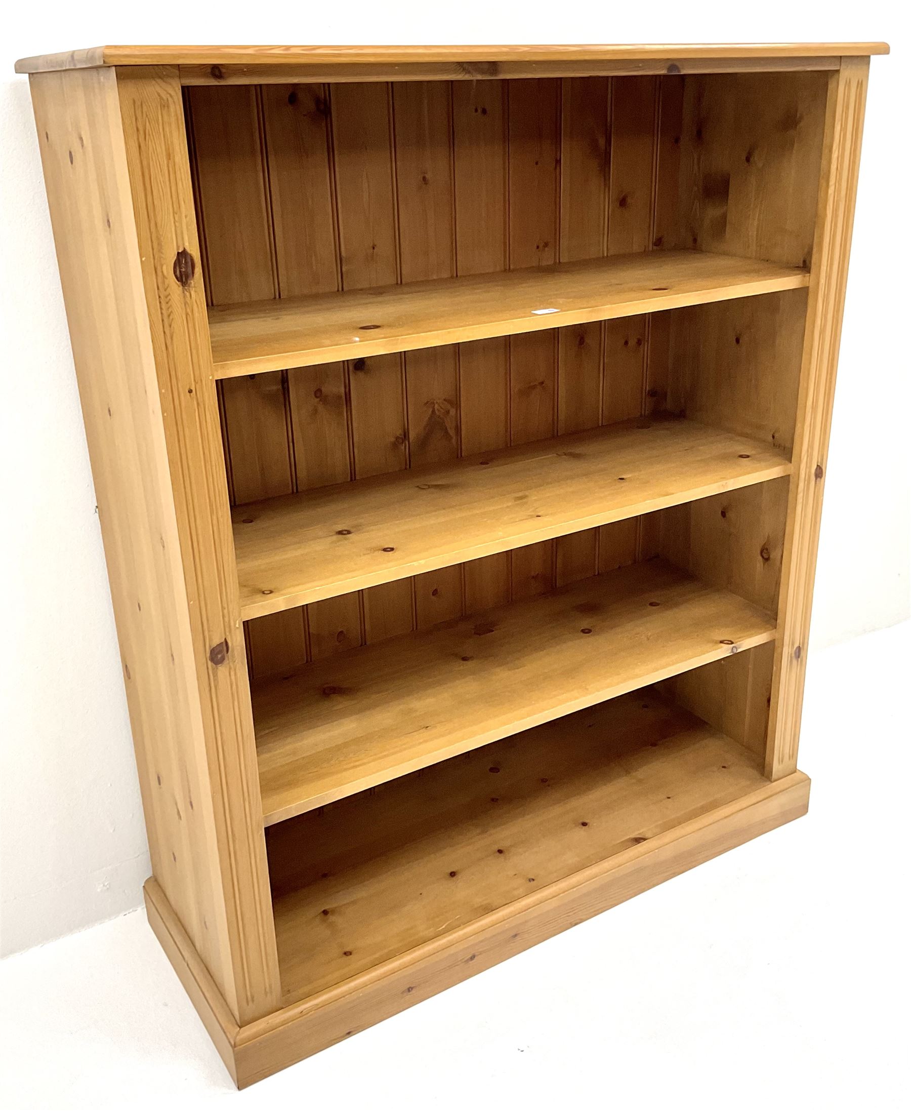 Pine bookcase, three shelves, platform base
