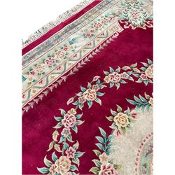 Large Chinese washed woollen plumb ground carpet, floral design