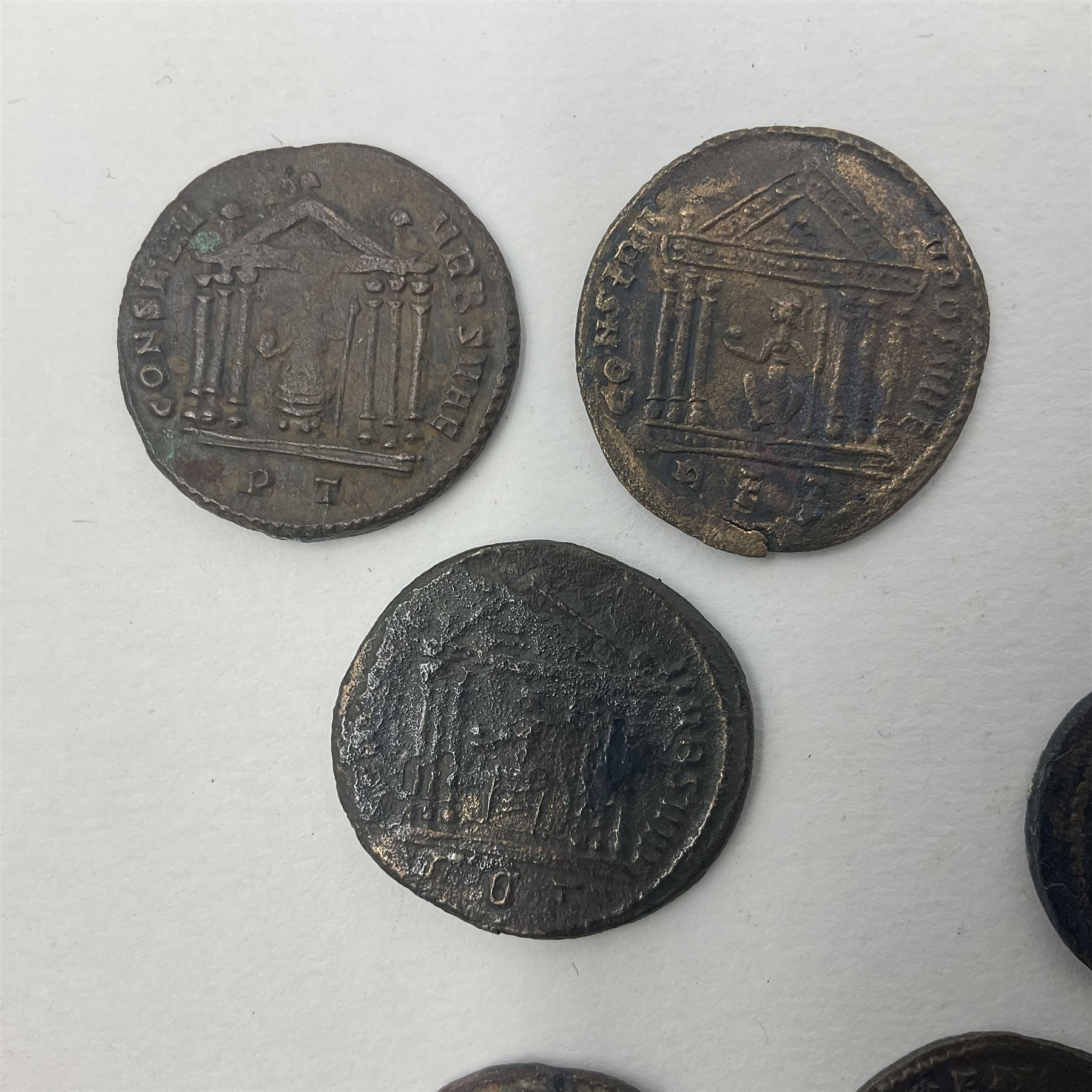 Roman Imperial Coinage, Maxentius (AD 306-312), fourteen bronze folles, most bearing rev. Roma seated in temple holding globe and sceptre (14)