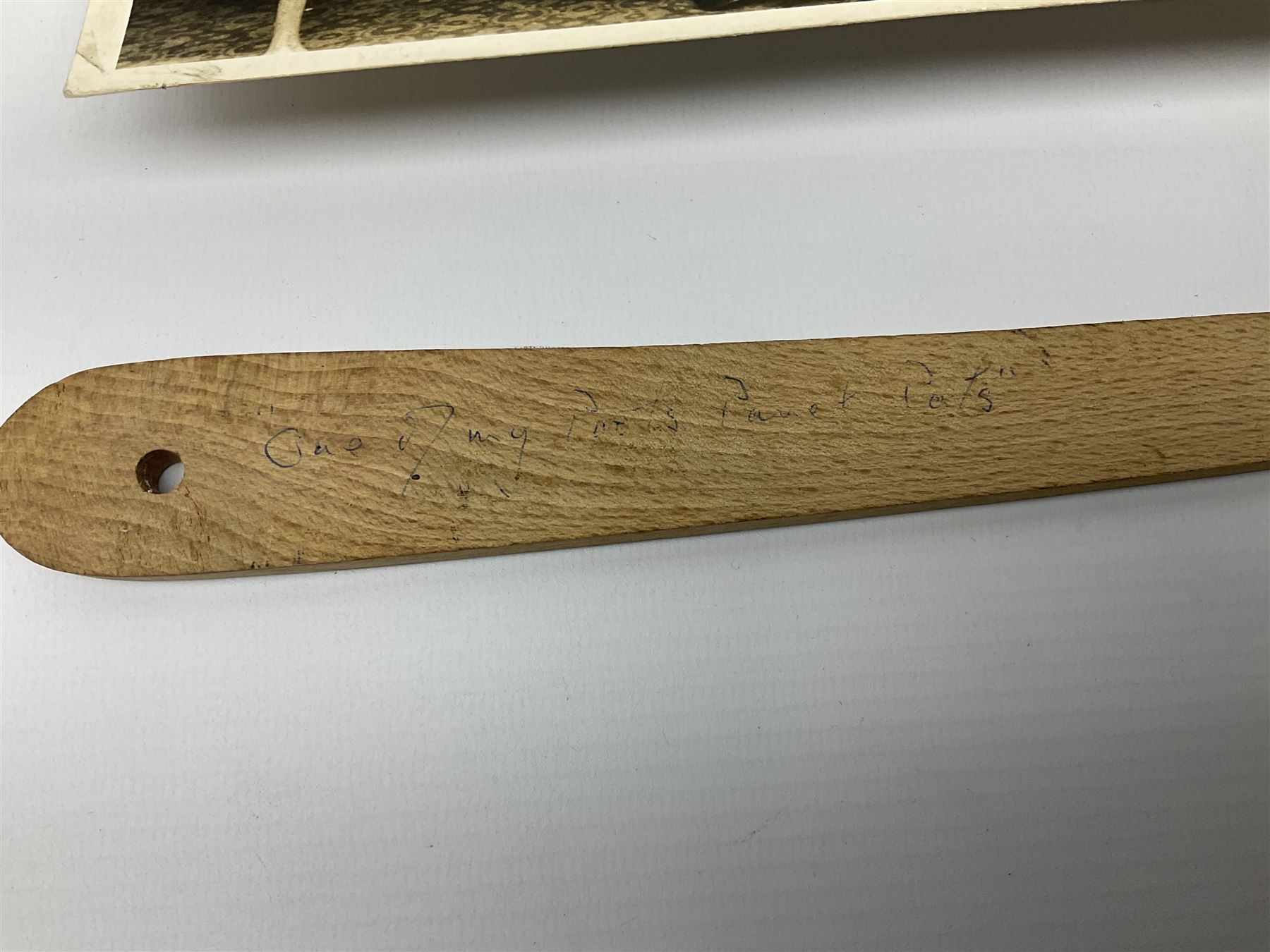 Early 1970s sepia photograph of the Pools Panel meeting at The Waldorf Hotel, London including Raich Carter, Marquis of Bath, Arthur Ellis, Neil Franklin etc 19 x 25cm; together with a beech spaghetti server with manuscript presentation inscription 'To Raich Carter from Henry 6th Marquis of Bath 1974'; Provenance: By direct descent from the family of Raich Carter having been consigned by his daughter Jane Carter (2)