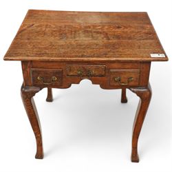 18th century country oak low-boy, deep rectangular top over three small drawers and shaped apron, on angular cabriole supports