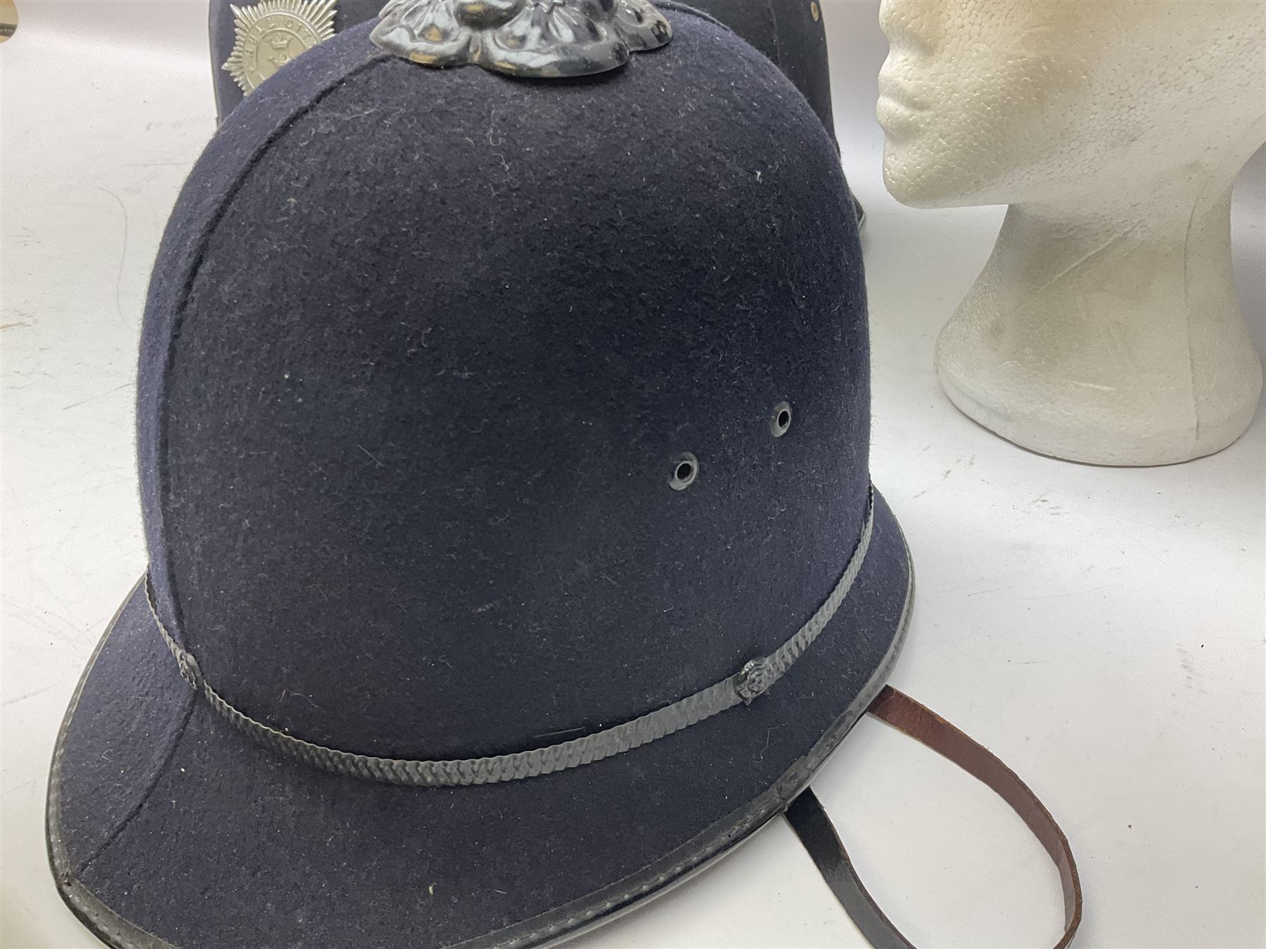 Hull City Police - helmet with king's crown night plate; two further ball-top helmets with Queen's crown plates; and a peaked cap (4)