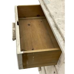 20th century painted pine chest of drawers, rectangular top over two short and two long drawers, scalloped apron, on castors