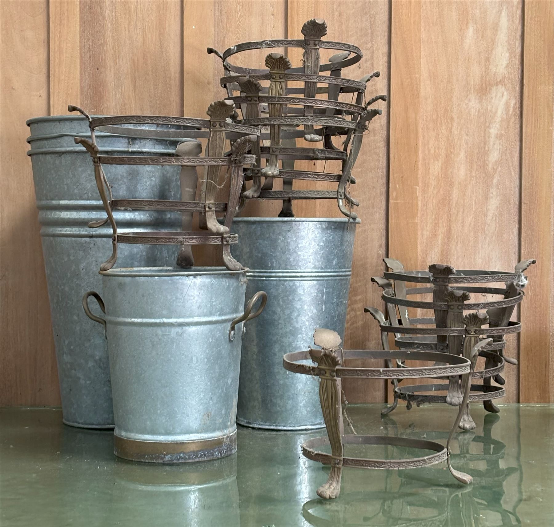 Set of ten floral cast gilt metal plant pot stands on paw supports (H16cm, internal diameter 19.5cm) together with five galvanised tin bouquet planters (largest H40cm) (15) - COLLECTION BY APPOINTMENT FROM: The White House, Thirsk Road, Easingwold, York, YO61 3NF - CALL 01723 507111 TO ARRANGE