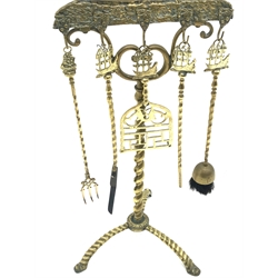 Early 20th century Dutch cast brass fireside companion stand, the galleon surmount supporting five fire tools, raised on a spiral twist stem and tripod feet, H123cm  