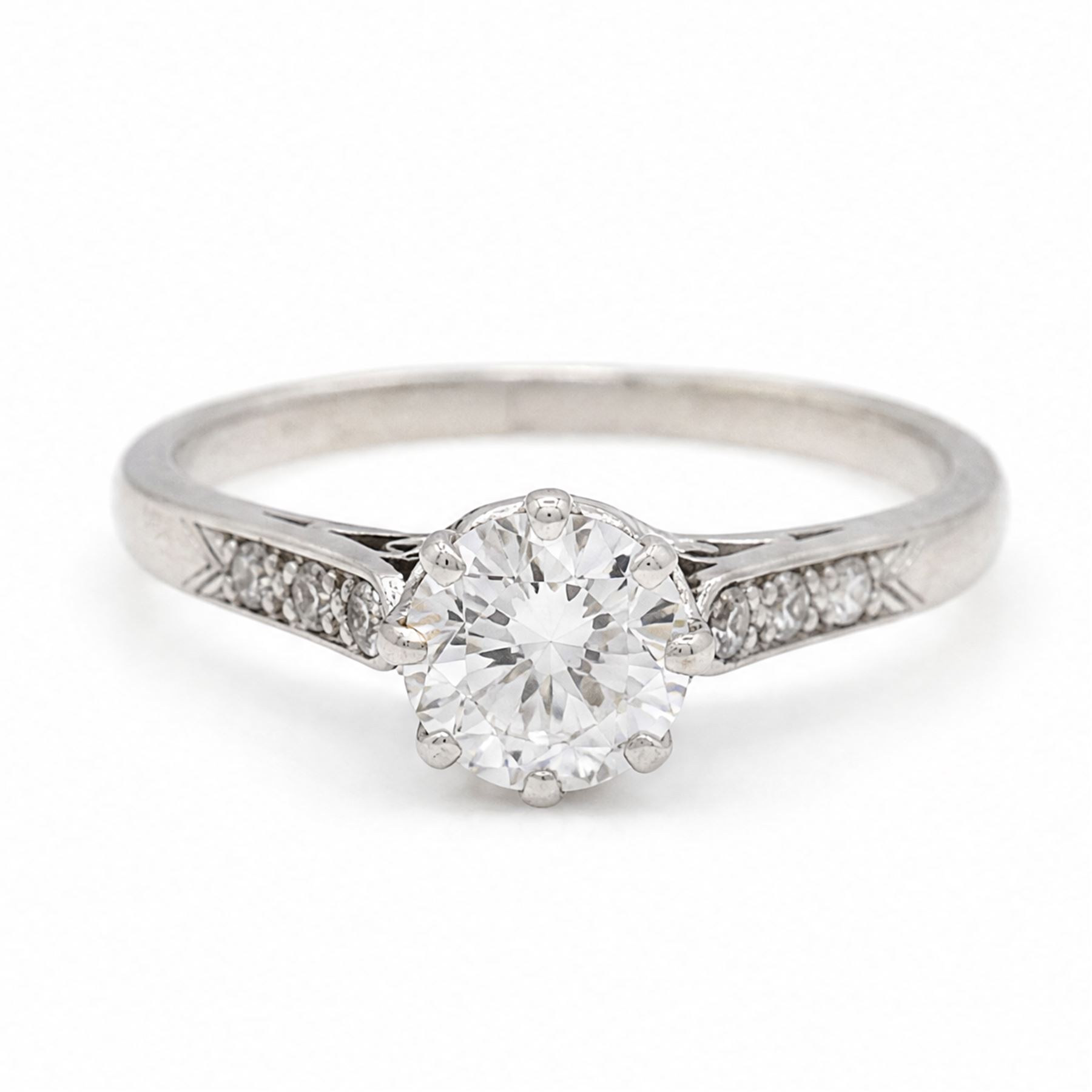 Platinum diamond ring, single round brilliant cut diamond of approx 0.85 carat, with diamond set shoulders, stamped Plat