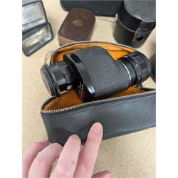 Kodak Dakon II folding camera and a collection of camera lenses and accessories, including Reflex-Nikkor  1:8 f=500mm, NikoN AF Nikkor 70-300mm 1:4-5.6G, Micro TM monocular lens and Teleshot adapter, two cases, Weston exposure meter, two cases etc