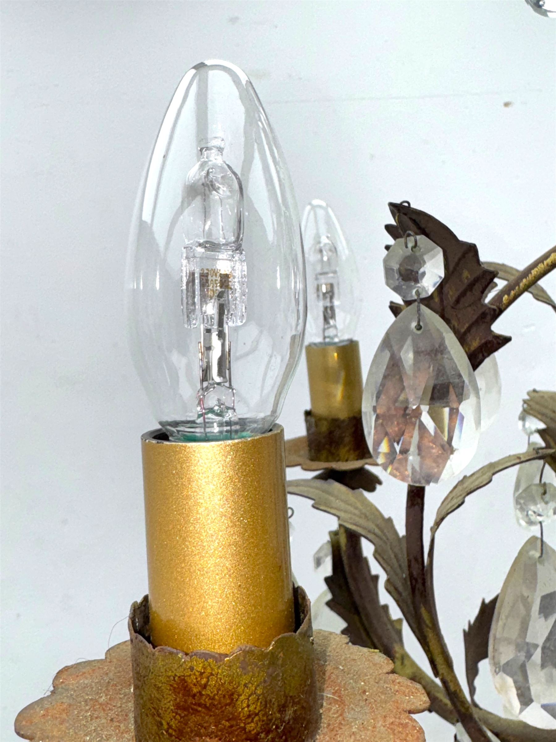 20th century distressed gilt tole chandelier, with six curved leaf clasped scrolling arms and frame, hung with lustre drops, approximately H50cm