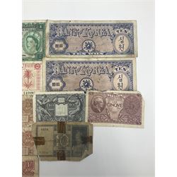 Banknotes including King George VI board of commissioners of currency Malaya one dollar 1st July 1941 'P/59 030908', Queen Elizabeth II Government of Hongkong one dollar 1st July 1952 'F/6 202153' etc