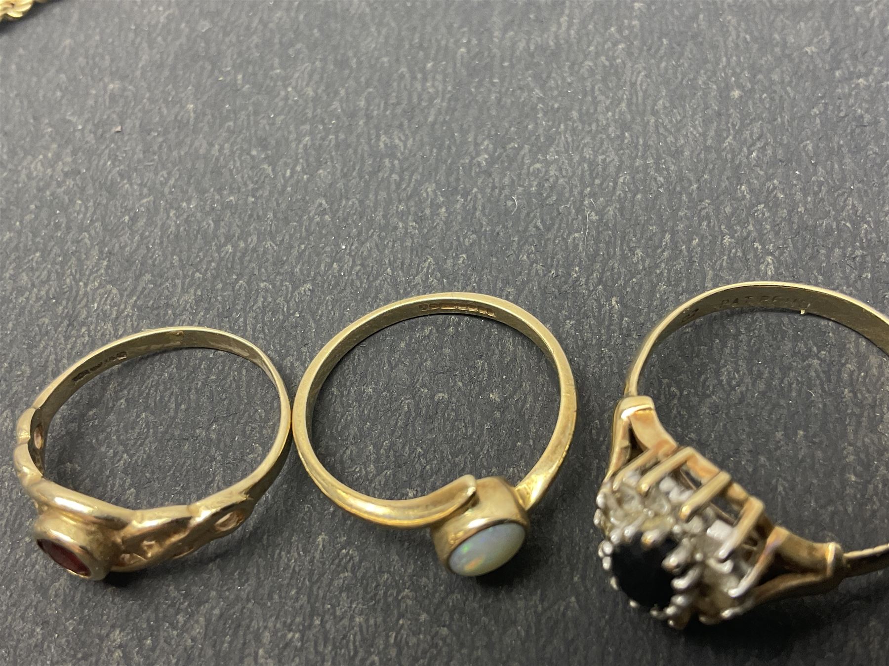 9ct gold jewellery, including opal ring and two other stone set rings, locket and rope twist chain 