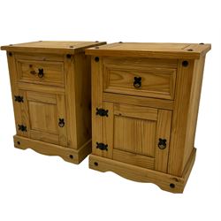 Pair of pine bedside cabinets, fitted with drawer and cupboard