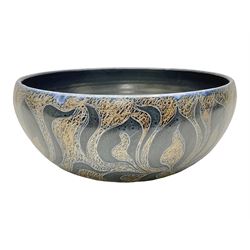 John Egerton (c1945-): studio pottery stoneware serving dish, decorated with abstract floral petals on a dark blue ground, D30cm