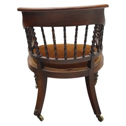 Late 19th-century captain's chair,  with spindle and bobbin turned shaped back, with brown velvet upholstered seat, raised on turned legs with brass castors, old damage and repairs 