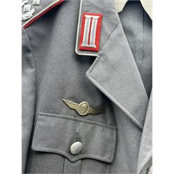 West German helmet steel helmet, together with 1960's peak cap and tunic with German insignias 