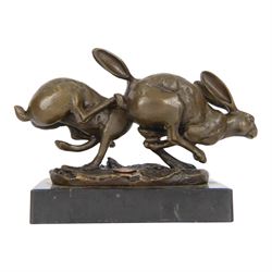Bronze figure group, modelled as two hares in chase, signed Nick, with foundry mark, upon a rectangular base, H11cm L15cm