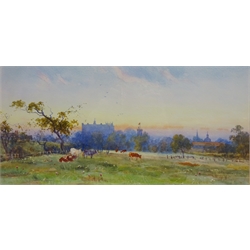  Cattle Grazing with Townscape in the Background, early 20th century watercolour signed by Arthur Varney 17cm x 35cm  