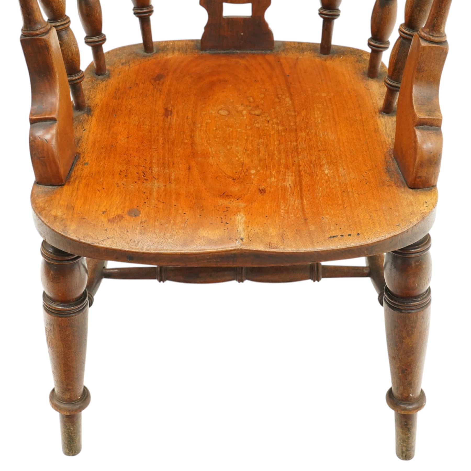 Victorian mahogany Captains chair, central roundel splat flanked by turned spindles, on turned supports united by double H-stretcher