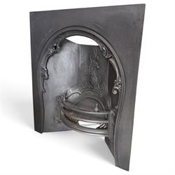 Victorian cast iron fireplace, the arched surround cast with scrolling foliate ornament an...