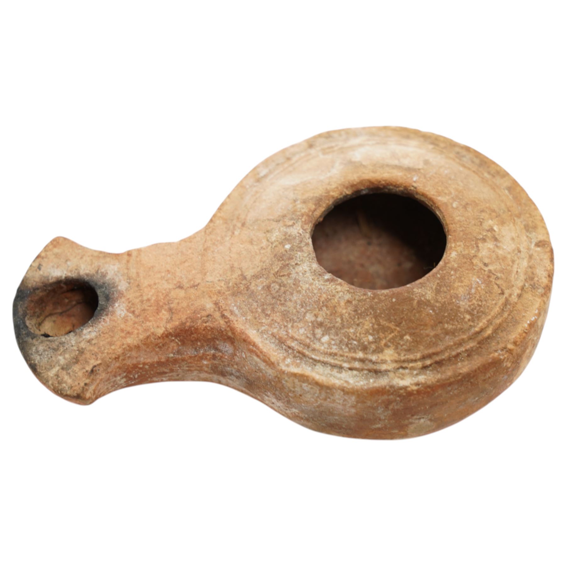 A group of five ancient terracotta oil lamps - Eastern Mediterranean (c.2nd century BC-1st century AD),
comprising a black-slipped Greek lamp (c.2nd-1st century BC) with a rounded body and narrow nozzle; a Herodian lamp (c.25 BC-75 AD) of compact form with central fill hole and pinched wick aperture; a Herodian lamp (c.1st century AD) with central raised disc and dotted ring motif; a Roman/Herodian hybrid lamp (c.50 BC-50 AD) with pronounced rounded shoulders and recessed top; and a further Roman/Herodian lamp (c.50 BC-50 AD) retaining an ancient carbonised wick fragment in the nozzle.
Provenance: By the vendor’s repute, acquired/collected in the Middle East (Dead Sea area/Syria) in the 1960s