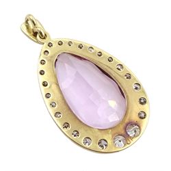 18ct gold Brazilian pink topaz and round brilliant cut diamond pendant, the milgrain set pear cut topaz of 8.80 carat, with graduating diamond surround and diamond set bail