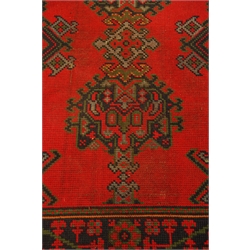  Turkish red ground rug, stylised decoration, 295cm x 148cm  