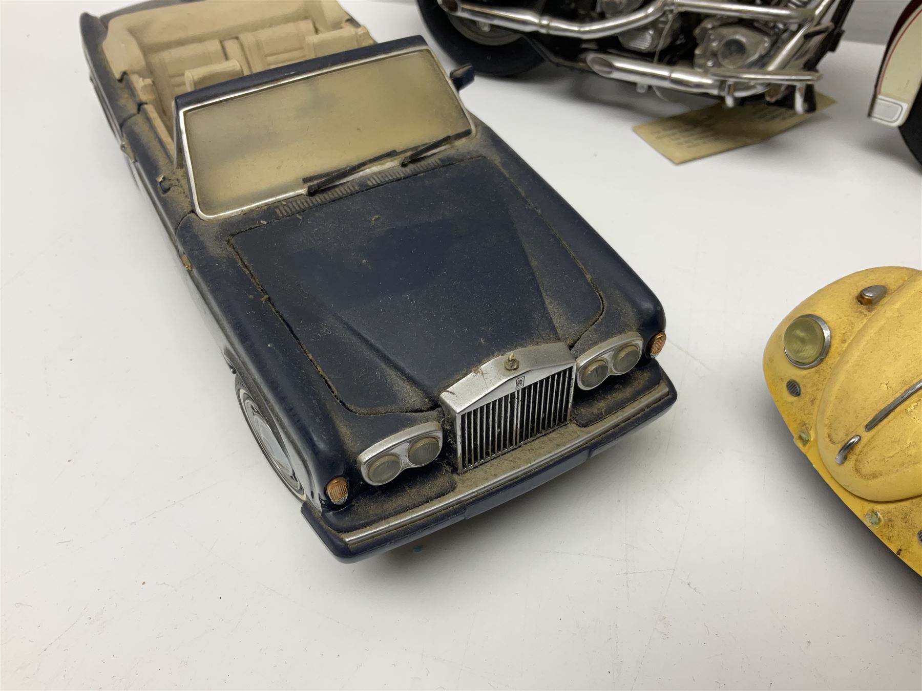 Franklin Mint - three die-cast models comprising 1:10 scale Harley Davidson Heritage Softail motorcycle, 1:24 scale 1957 VW Beetle and 1:24 scale 1993 Rolls Royce Corniche IV; all unboxed (3)