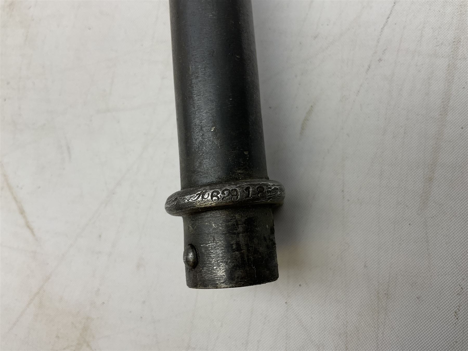 French Lebel Model 1886/93/16 bayonet with 52cm steel cruciform blade and brass hilt No.R22136; in steel tapering round scabbard numbered A62918 L65.5cm overall