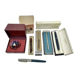 Three fountain pens, to include Conway Stewart 'Dinkie 550' and 'Conway 57' and a Parker 'Slimfold', all with 14ct gold nibs, together two roller ball pens, including a Parker example and a Swarovski Crystal paperweight