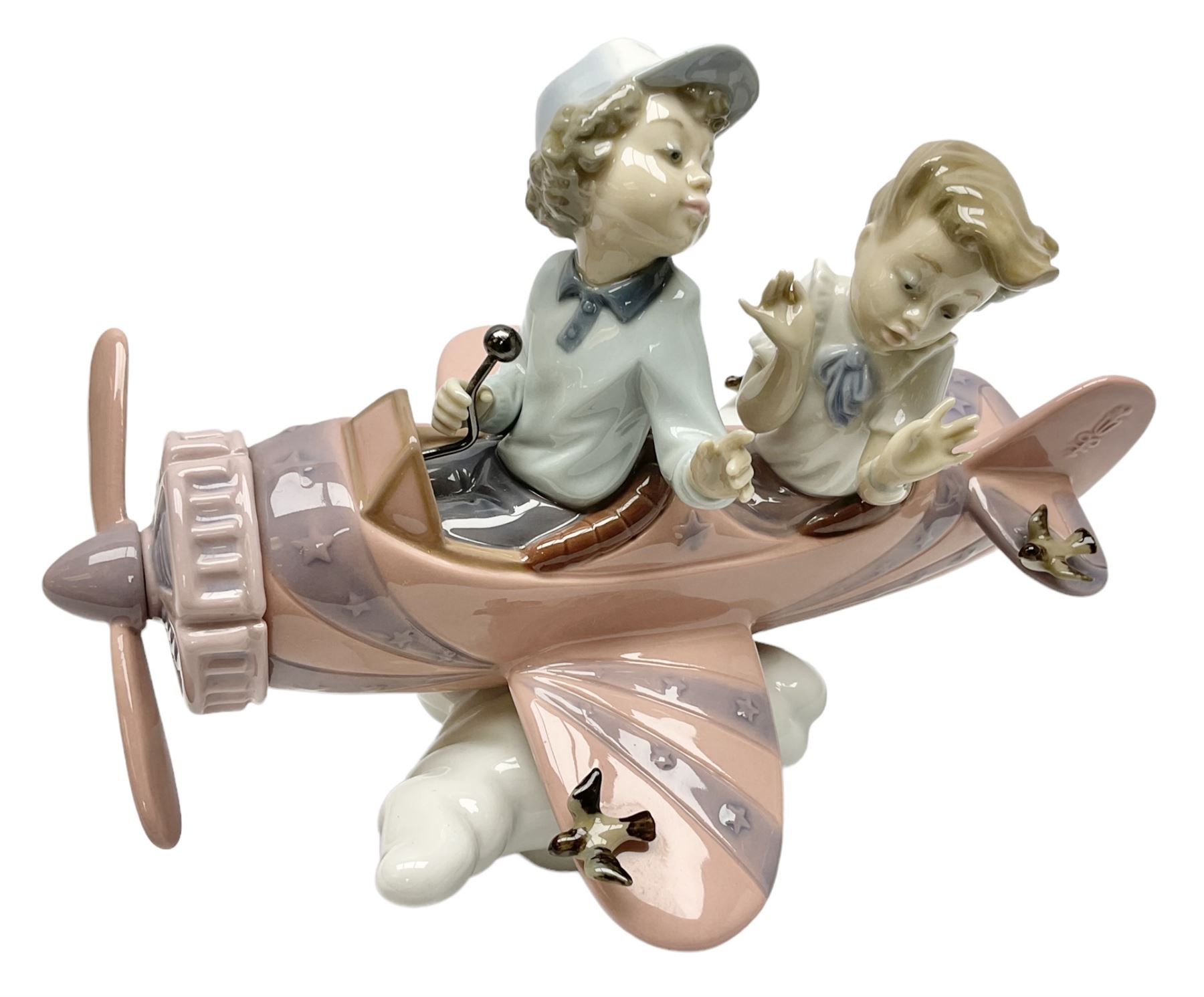 Lladro figure, Don't Look Down, modelled as a girl and boy in a plane, sculpted by Joan Coderch, no 5698, year issued 1990, year retired 2004, H17cm