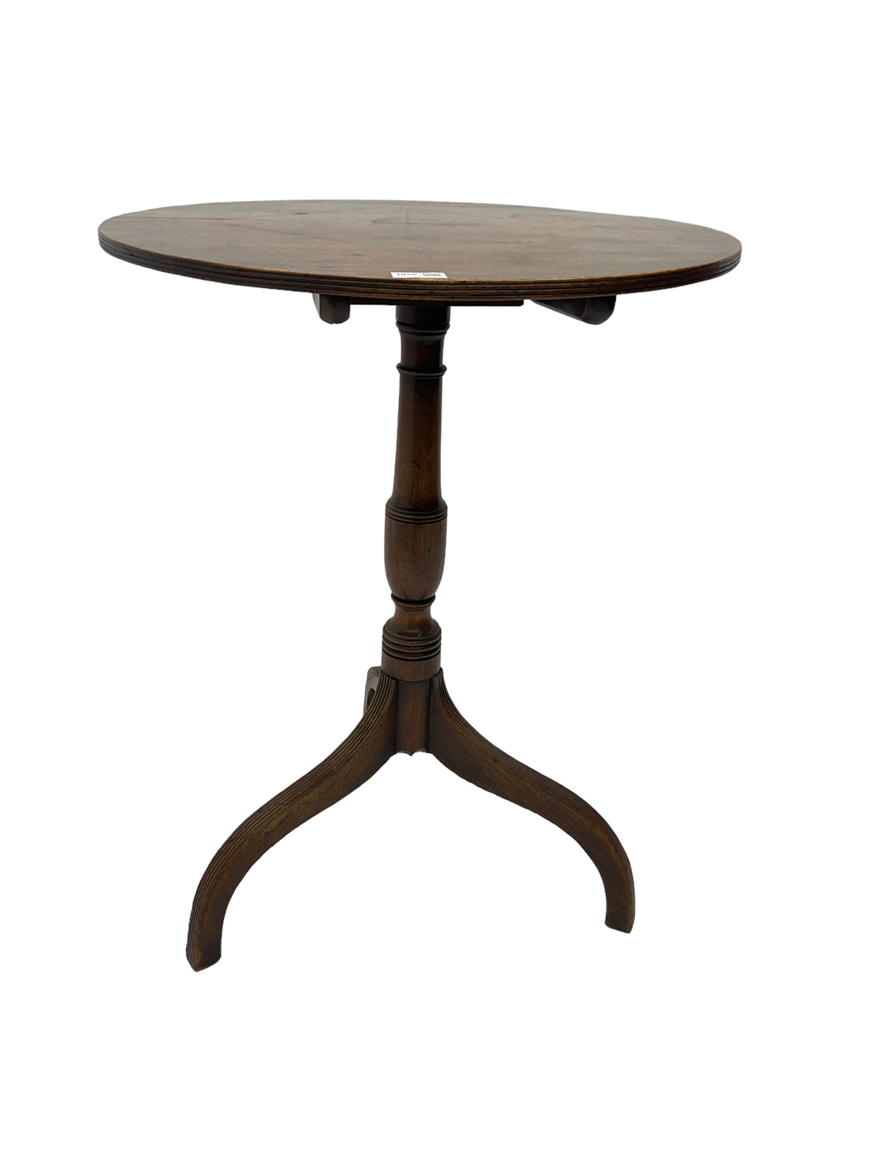 Early 19th century mahogany tilt-top pedestal table, the circular top with reeded edge, raised on turned support with reeded tripod base