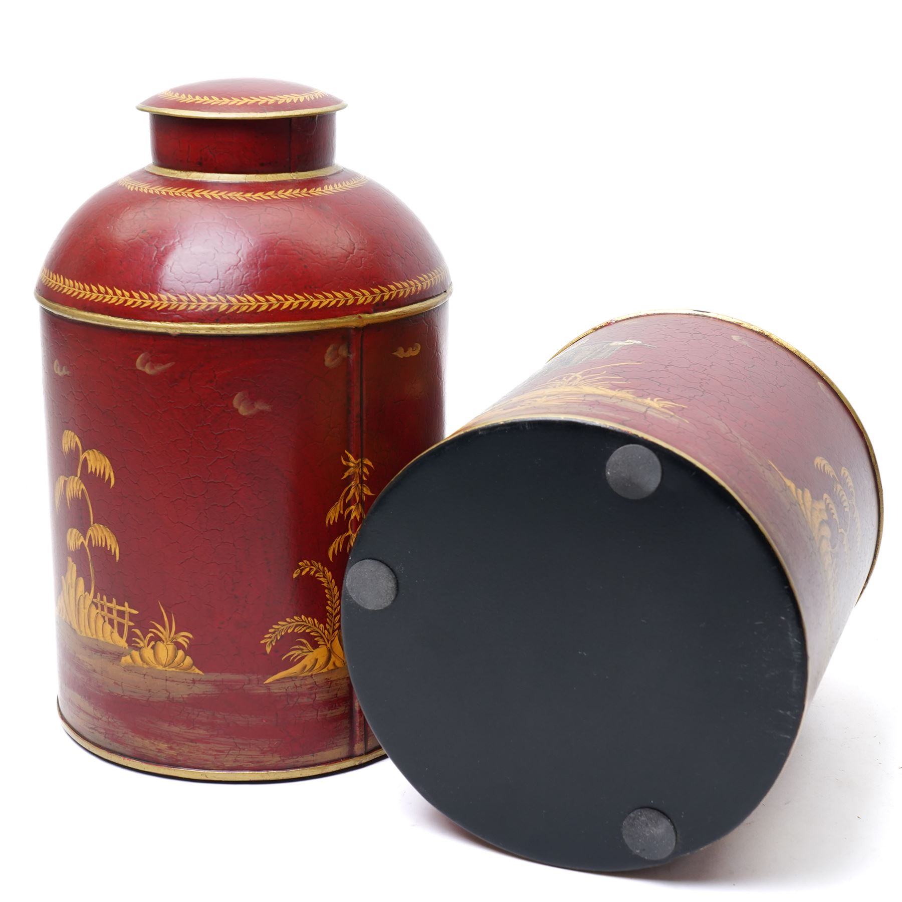 Pair of red toleware style tea cannisters, painted with fishermen, H36cm 