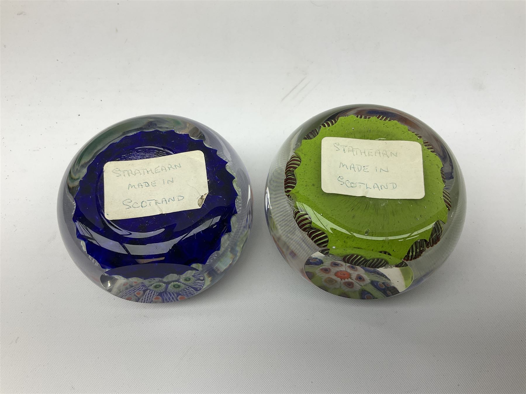 Five Millefiori glass paperweights, of differing designs, predominately by Strathearn