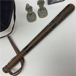 Police - Victorian turned hardwood truncheon with traces of decoration and VR cypher L42cm; Humberside Police helmet with Queens Crown helmet plate; hand lamp inscribed 'The Inspector'; and small pair of pewter figures of police officers (5)