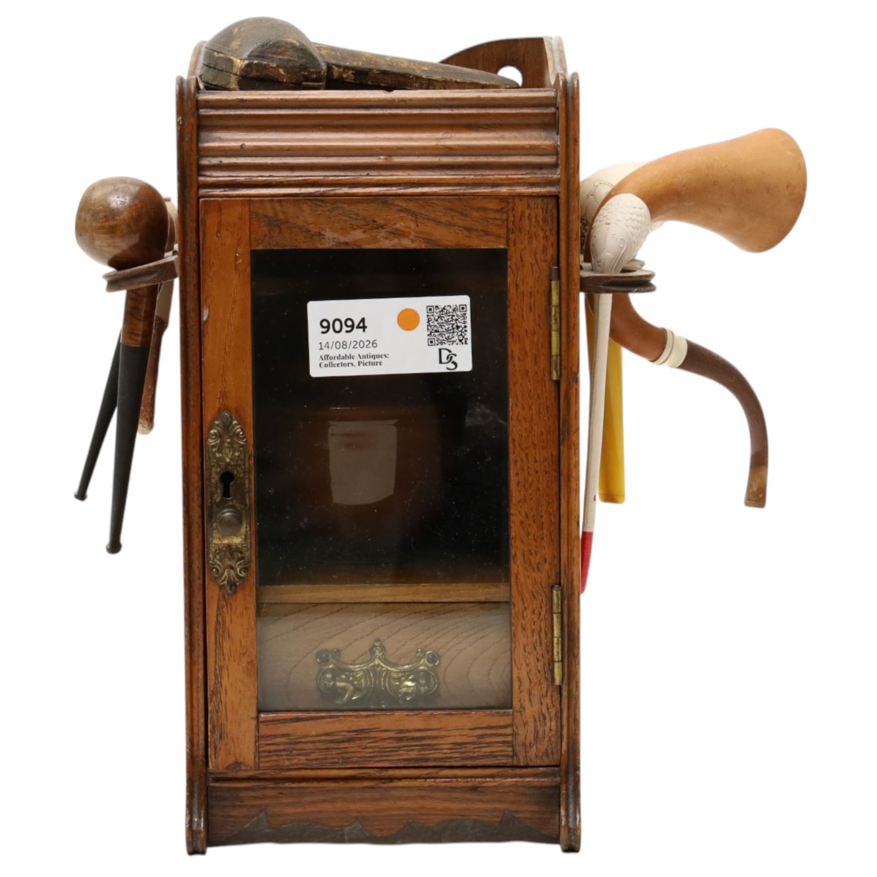 Small Edwardian oak smoker's cabinet with tobacco jar, Meerschaum pipe, three clay pipes, cigar cutter etc