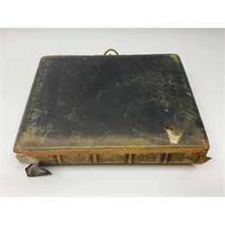  Victorian leather bound photo album, the interior leaves containing apertures of various sizes and shapes of portraits surrounded by printed floral designs, with brass clasp and painted gold decoration to edges, H30cm