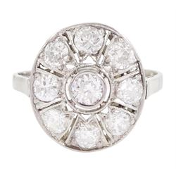 Continental Art Deco platinum nine stone old cut diamond oval panel ring, the central bezel set diamond, with pierced and milgrain set diamond surround, total diamond weight approx 0.95 carat