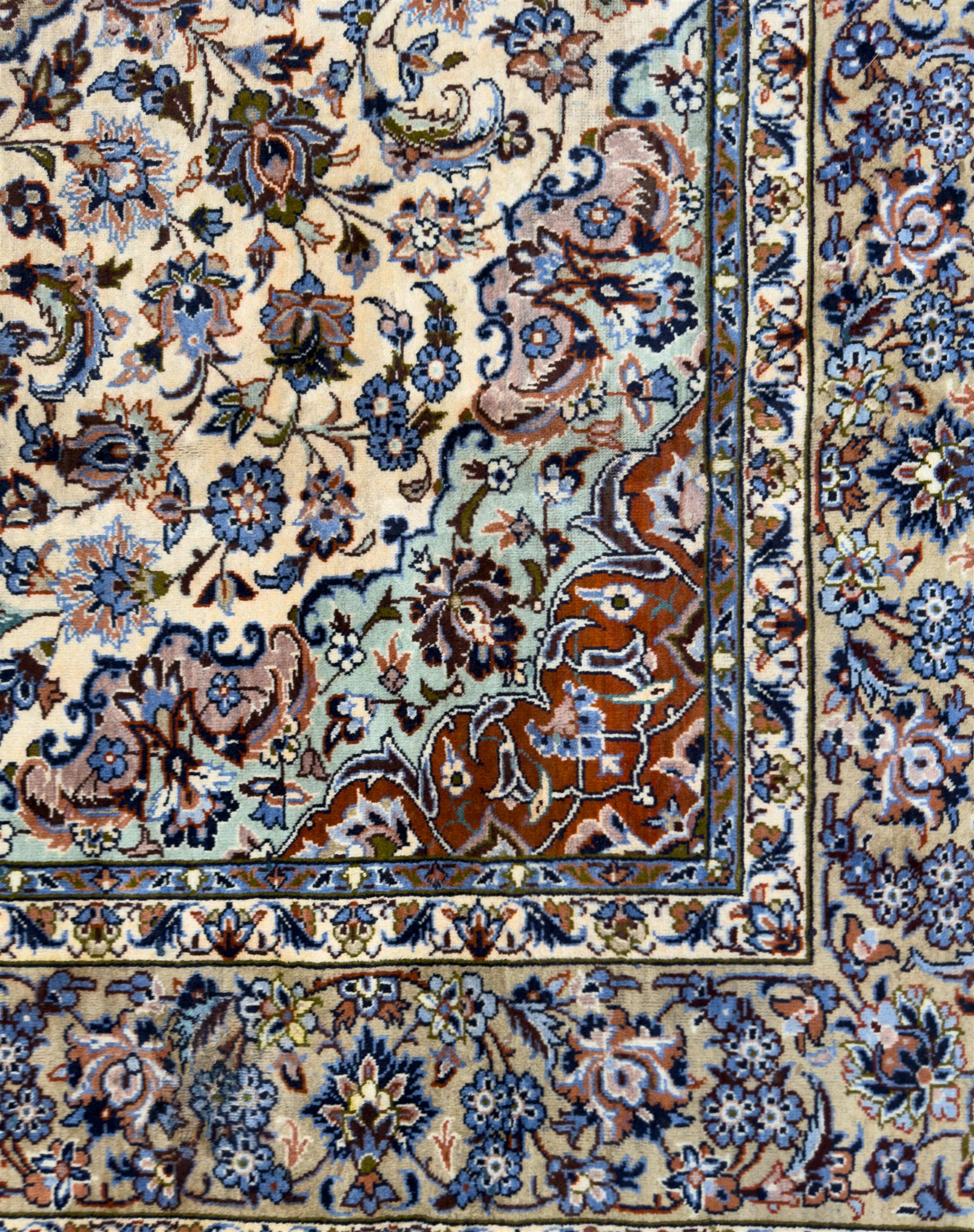 Central Persian Najafabad hand-knotted carpet, the ivory field with a central floral medallion radiating palmettes and arabesques in tones of blue, lilac and tan, enclosed by a wide navy border of scrolling vine and rosette motifs, with red spandrels and multiple guard stripes