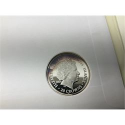 Four coin covers, comprising 2000 'The Queen Mother's 100th Birthday Silver Coin & Banknote Cover' limited edition 56/500, 2000 'Charles Darwin Commemorative Coin & Banknote Cover' limited edition 68/500, 2001 'Celebrating the 100th Birthday of Her Majesty The Queen Mother' containing  a 1999 silver one pound coin and 2001 'Royal Navy Submarines 100th Anniversary Cover' containing 2001 Turks & Caicos Islands 20 crowns silver coin